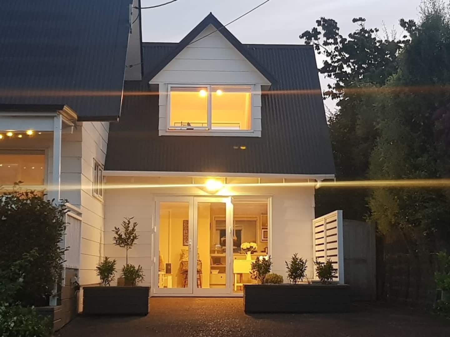 Kōtare guest house glowing at dusk