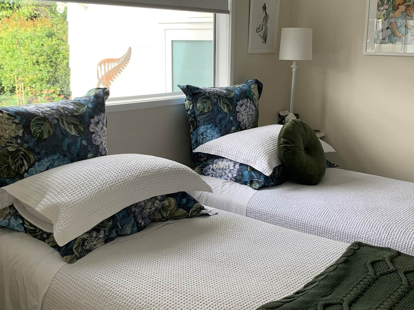 Bedroom with teal cushions